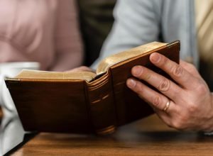 people-kitchen-reading-from-bible
