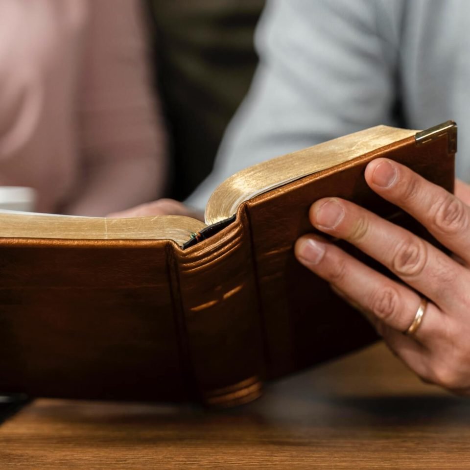 people-kitchen-reading-from-bible